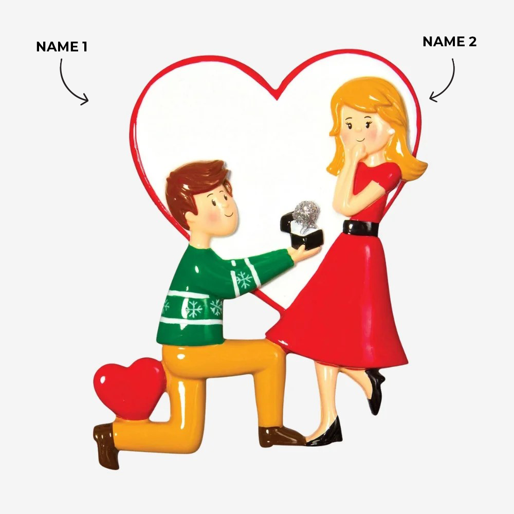 Man on knees proposing ornament